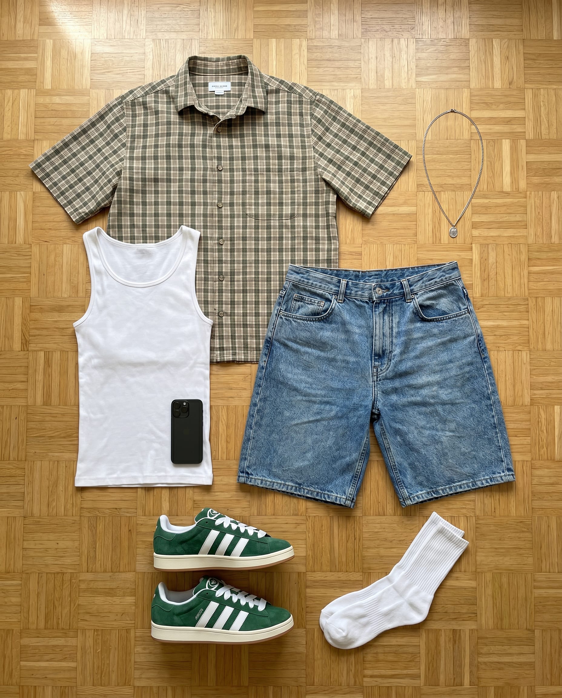 Men's Summer Streetwear Outfit: Olive Plaid Shirt & Denim Shorts flat-lay