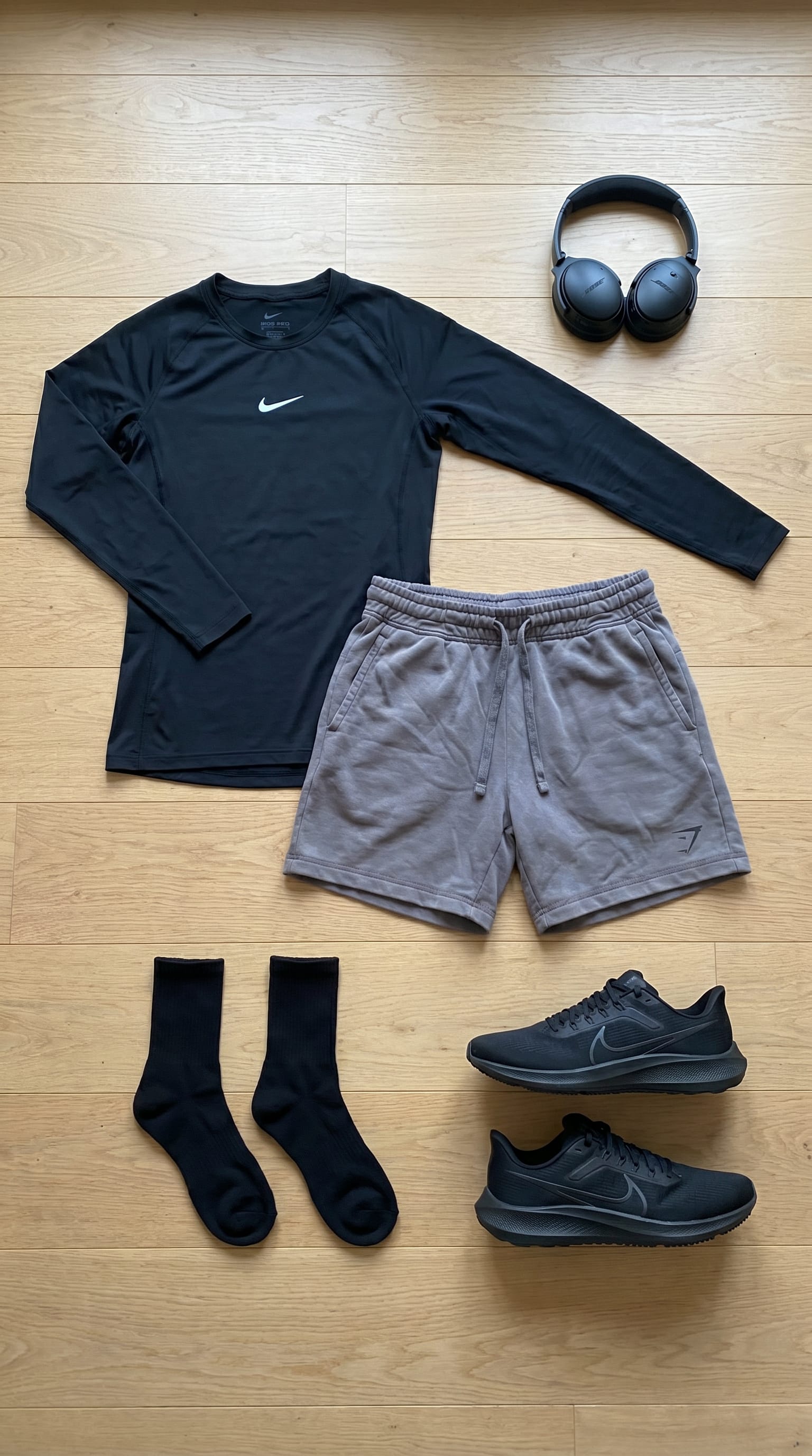 Black Shirt and Grey Shorts Outfit Men flat-lay
