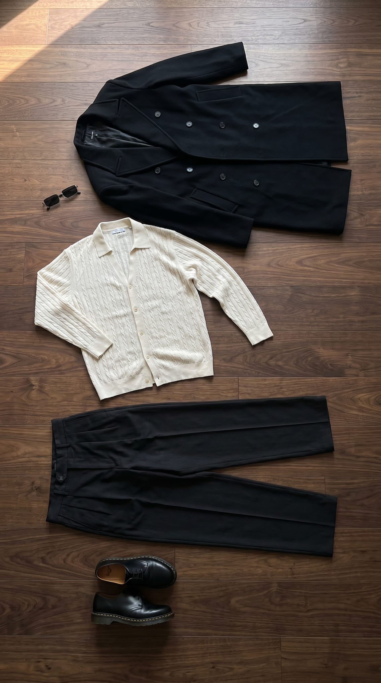 Winter Minimalist Outfit Men: Black Trousers and Off-White Knit flat-lay