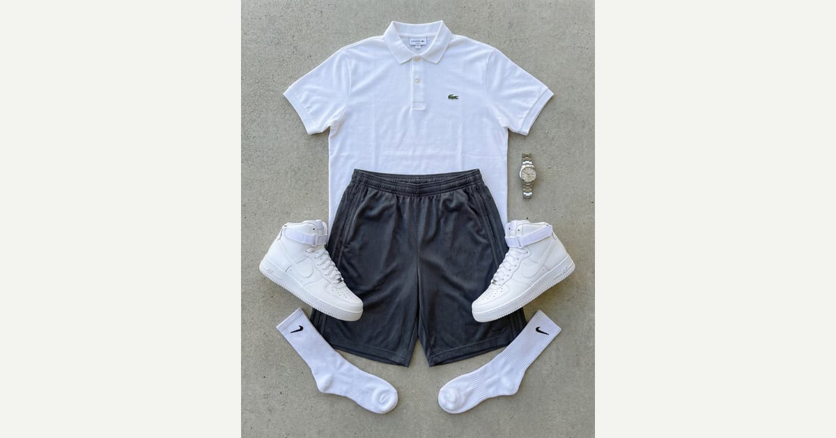 White polo. Charcoal grey short. — outfit flat-lay