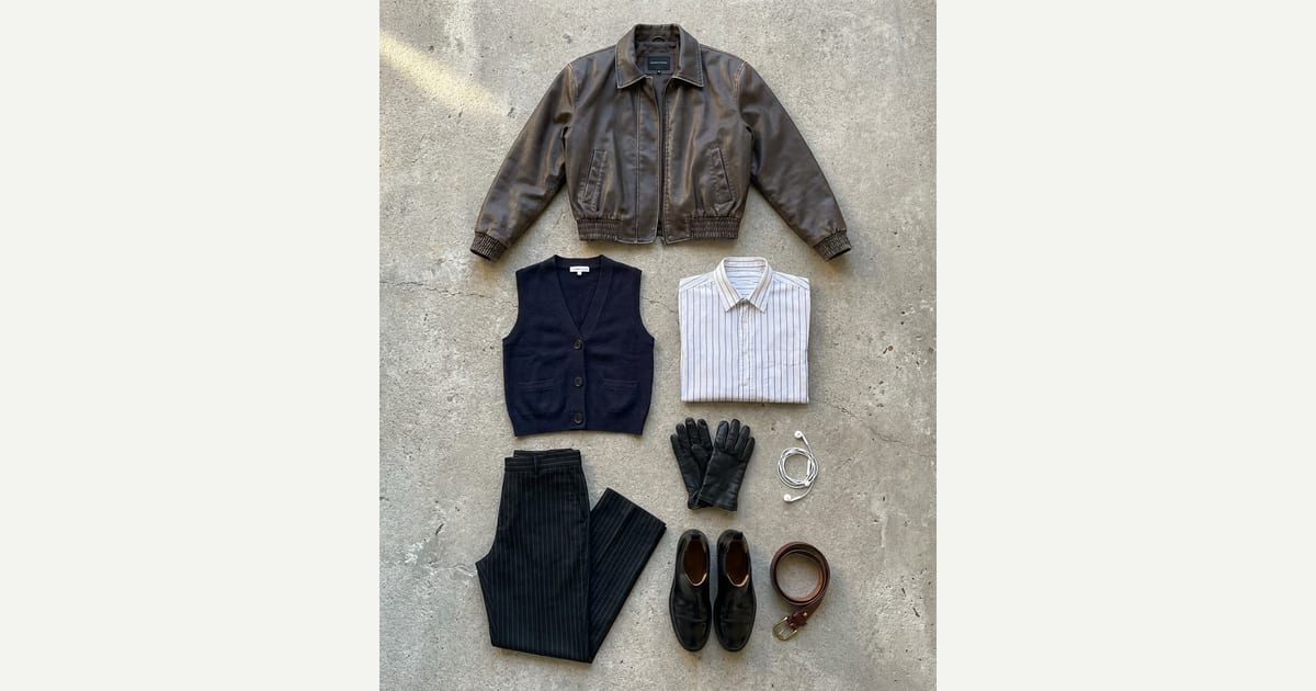 Distressed brown jacket. Black trouser. — outfit flat-lay