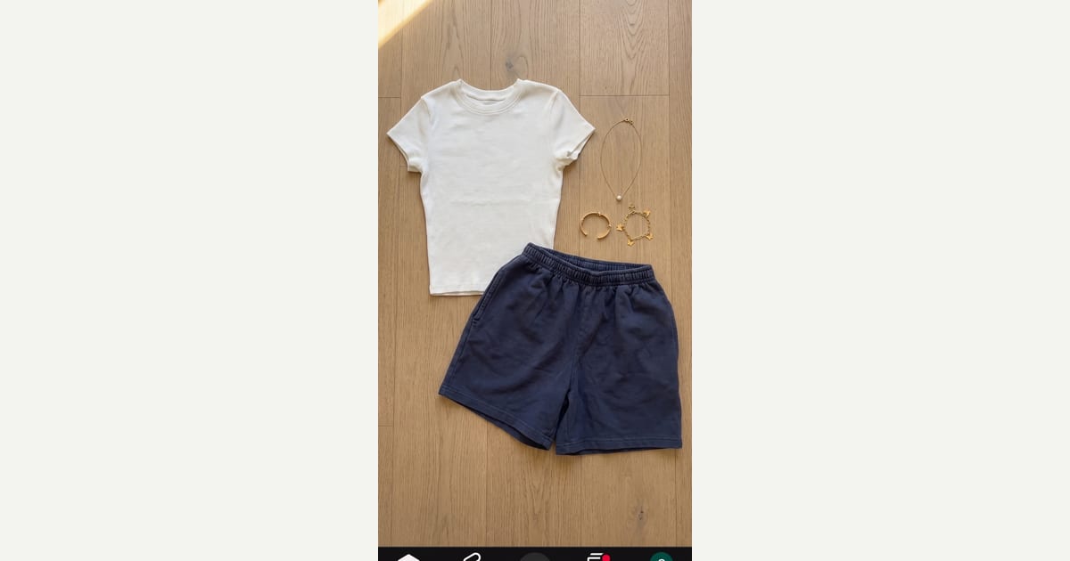 White tee. Navy blue short. — outfit flat-lay